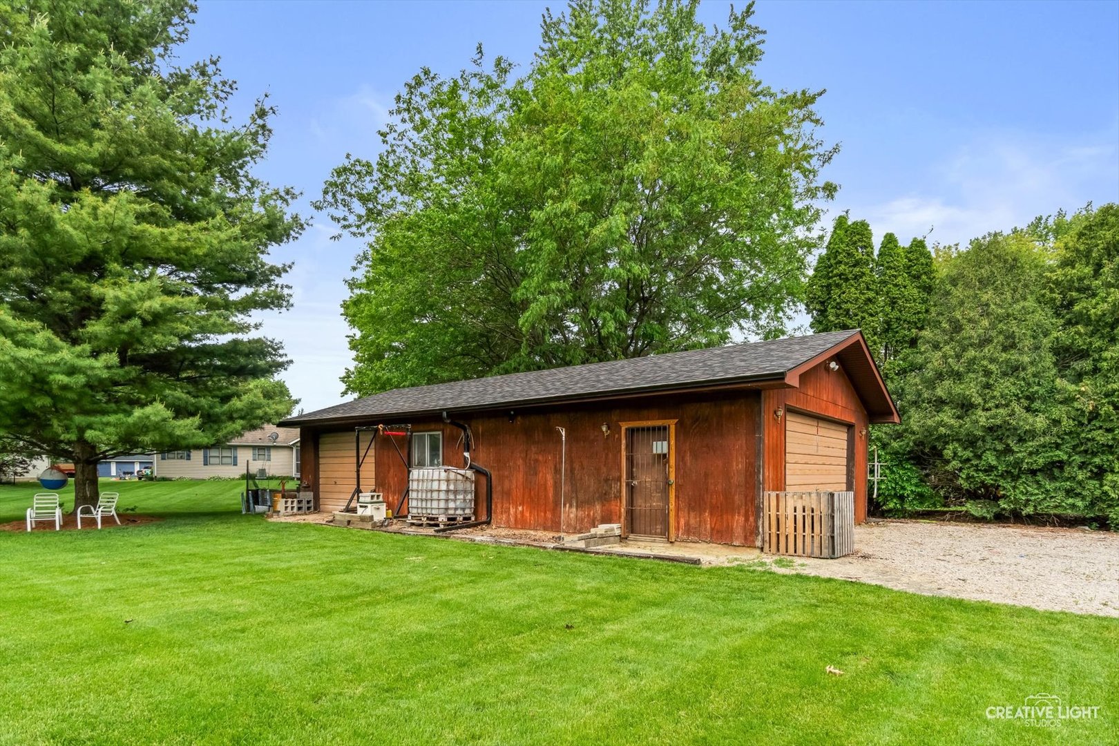 1483 Nova Road Sandwich, IL 60548 - Photo 23 of 29 a front view of a house with a garden
