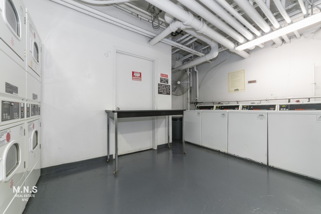 65 West 55th Street, Unit PHRE Manhattan, NY 10019 - Photo 3 of 12 a view of a storage & utility room with cabinets