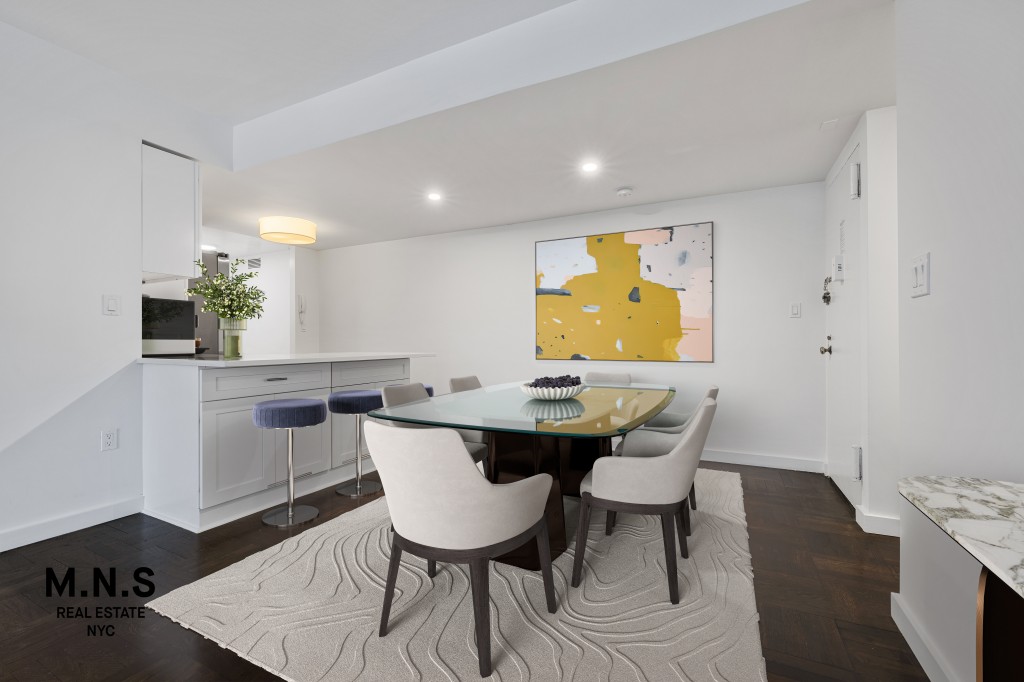65 West 55th Street, Unit PHRE Manhattan, NY 10019 - Photo 5 of 12 a view of a dining room with furniture and wooden floor