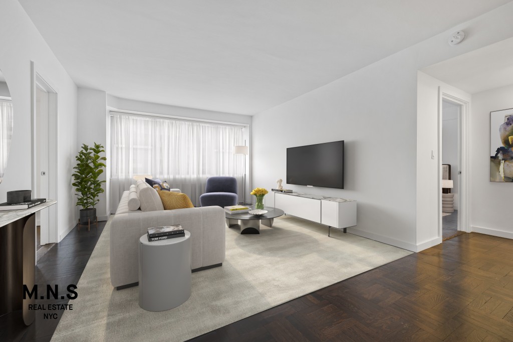 65 West 55th Street, Unit PHRE Manhattan, NY 10019 - Photo 8 of 12 a living room with furniture and a flat screen tv