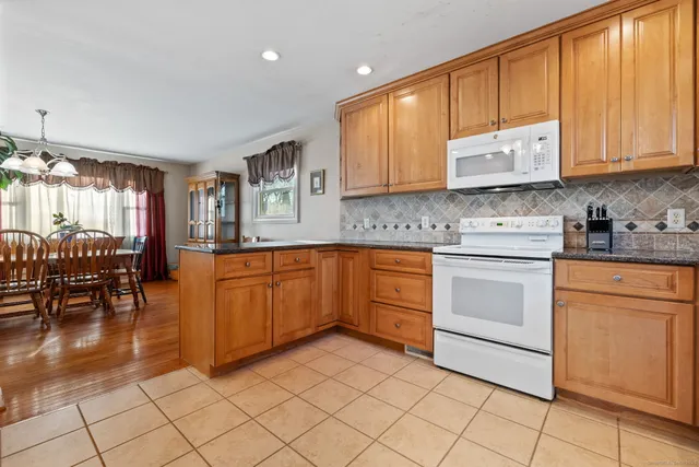 a kitchen with a sink cabinets and window