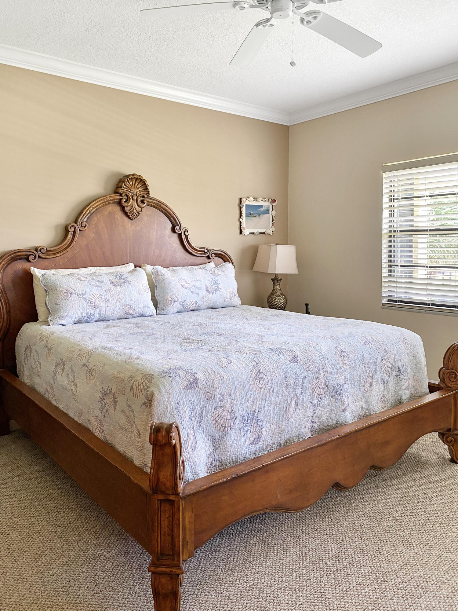 275 South Beach Road, Unit B202 Jupiter, FL 33469 - Photo 12 of 25 a bedroom with a bed and window