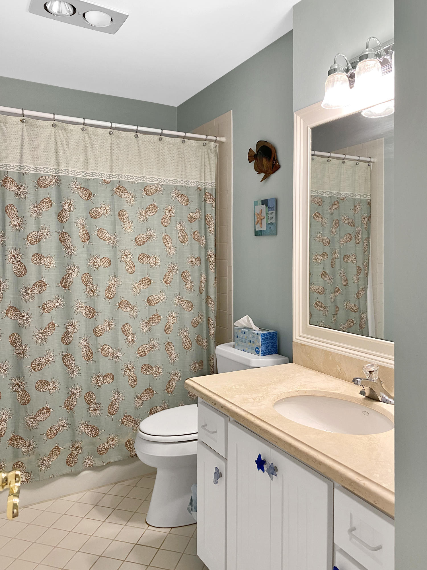 275 South Beach Road, Unit B202 Jupiter, FL 33469 - Photo 21 of 25 a bathroom with a sink a toilet and shower curtain