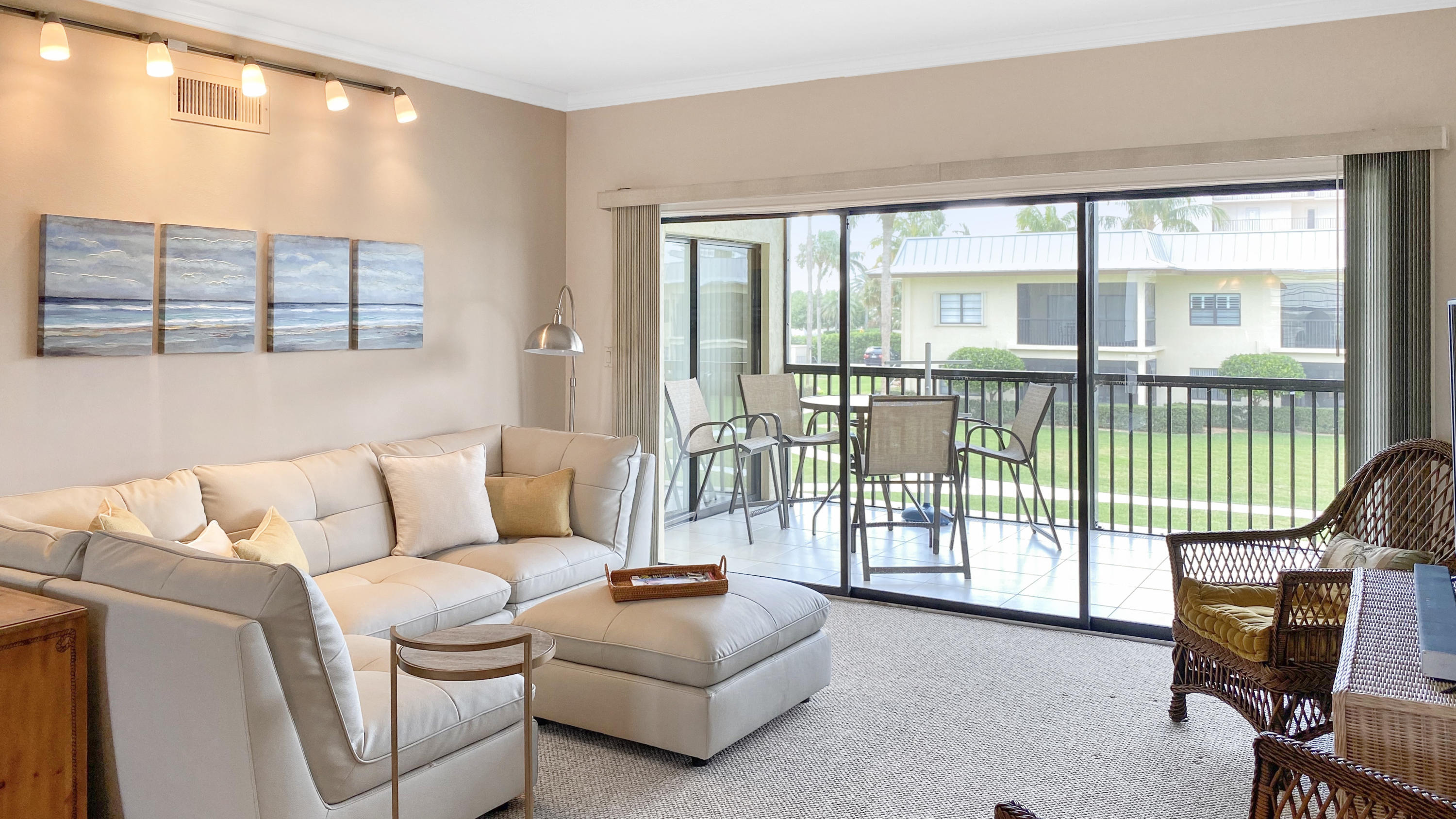 275 South Beach Road, Unit B202 Jupiter, FL 33469 - Photo 6 of 25 a living room with furniture and a floor to ceiling window