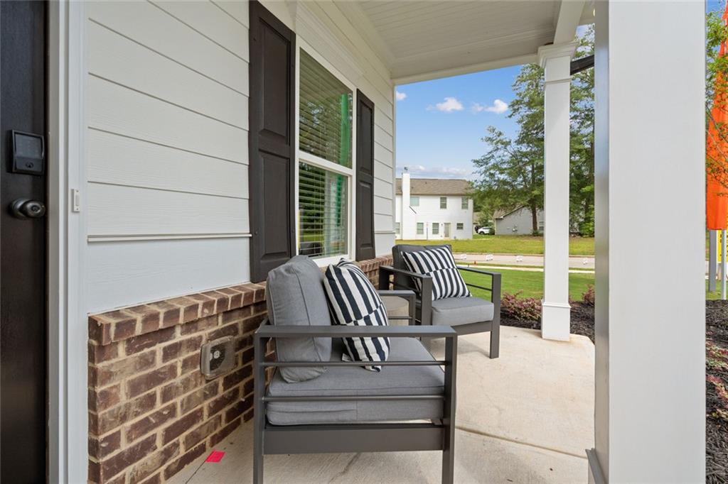 11 Willow Circle Rock Spring, GA 30739 - Photo 2 of 40 a balcony with chairs and city view