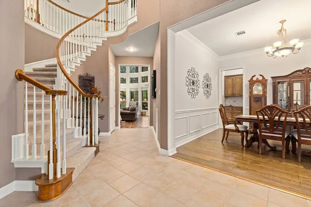 a view of a dining room with furniture and a window