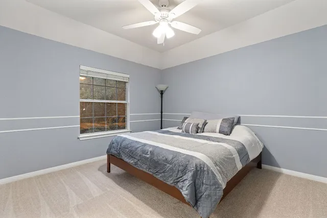 a spacious bathroom with a double vanity sink a mirror and a bathtub
