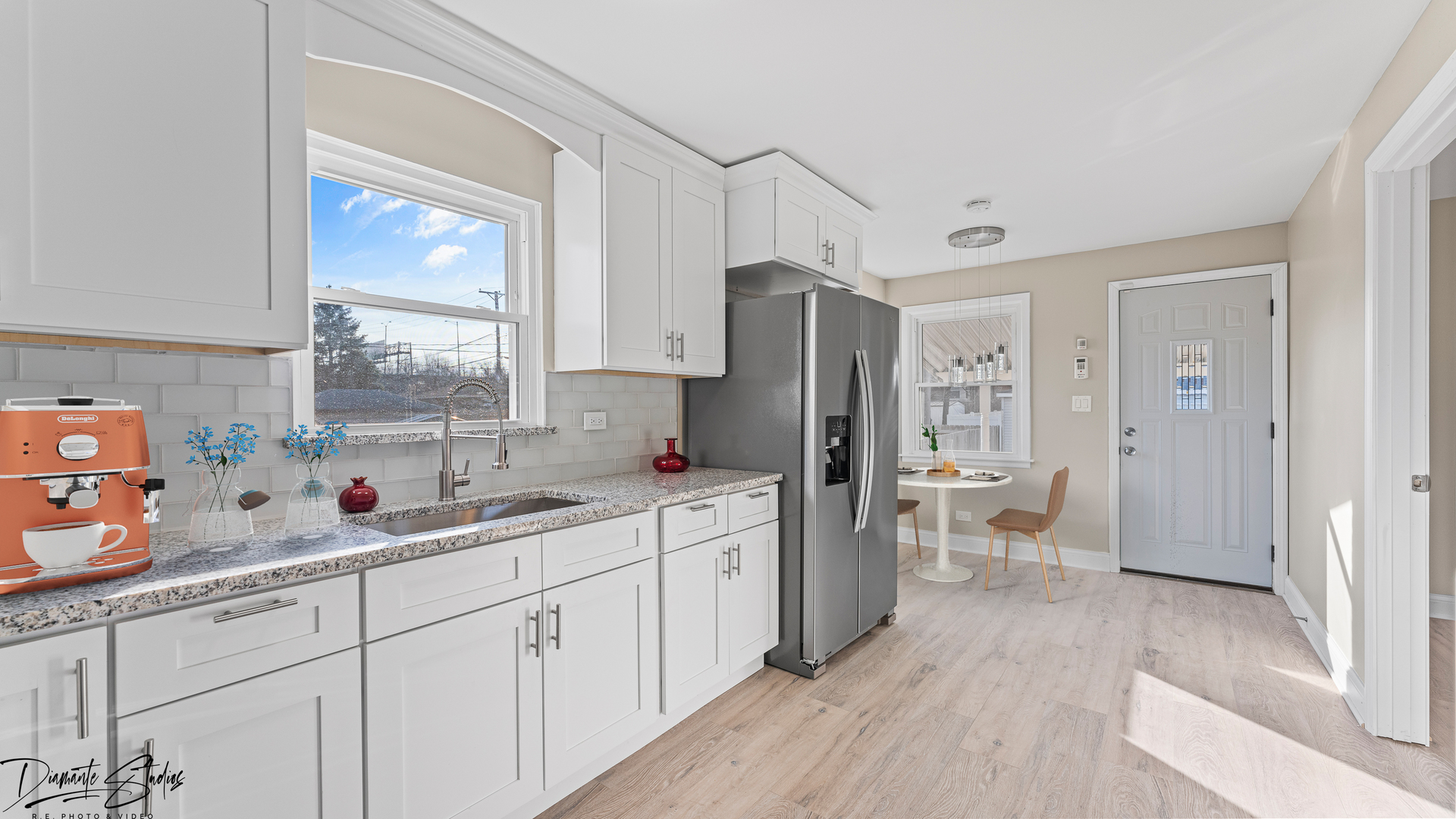 244 North Wolf Road Hillside, IL 60162 - Photo 3 of 12 a kitchen with a sink stove and refrigerator