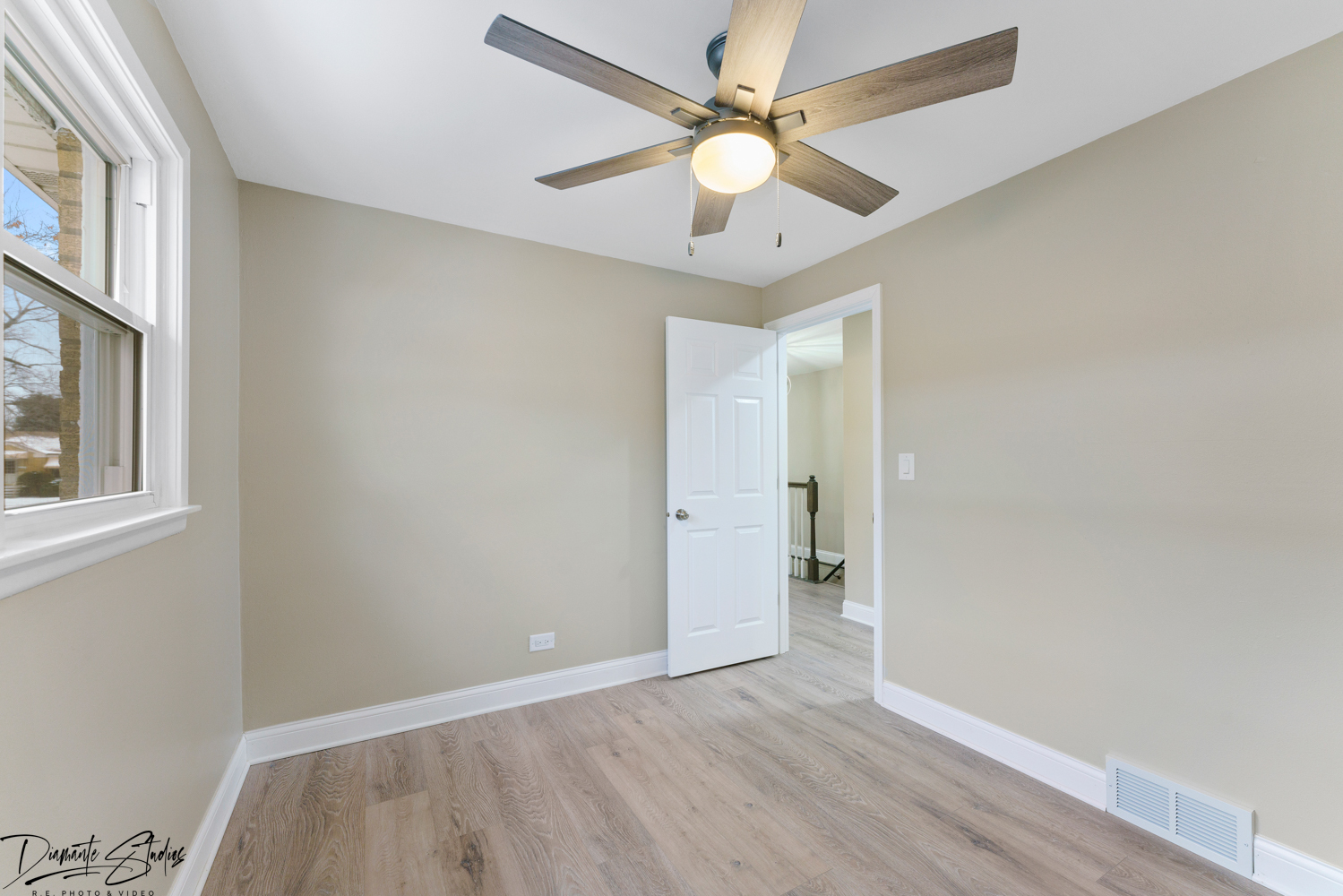 244 North Wolf Road Hillside, IL 60162 - Photo 7 of 12 wooden floor in an empty room with a window