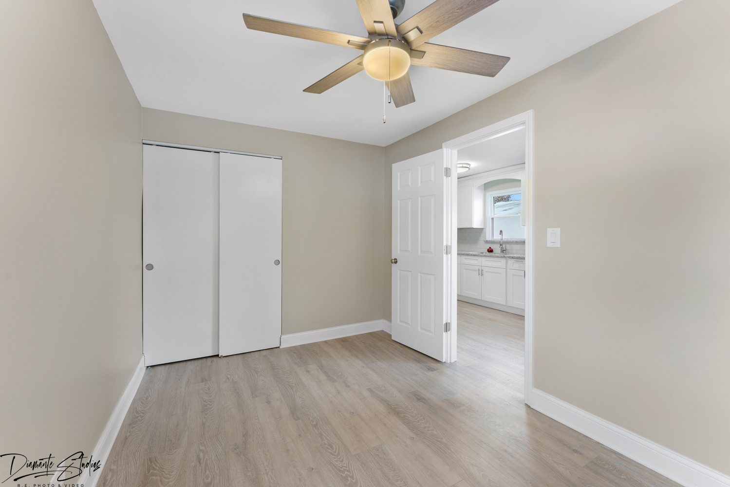 244 North Wolf Road Hillside, IL 60162 - Photo 9 of 12 an empty room with closet and a ceiling fan