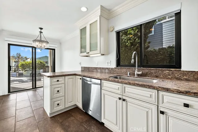 a bathroom with a toilet a sink a mirror a vanity and shower