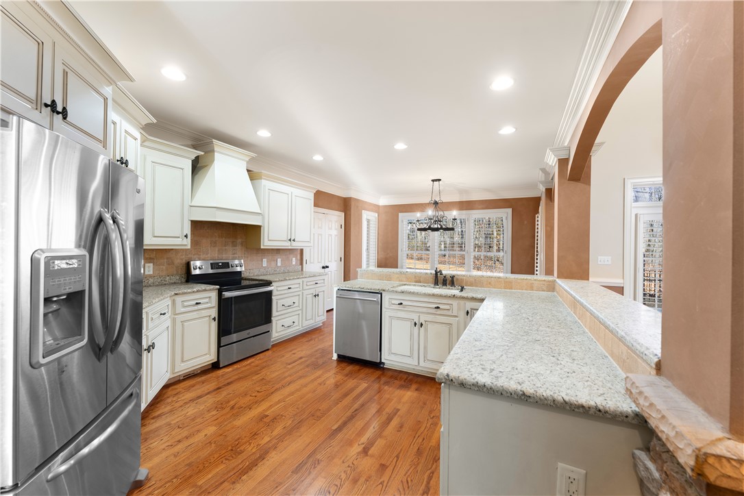 109 Limelight Drive Anderson, SC 29621 - Photo 5 of 34 This kitchen features a welcoming design with beautiful hardwood floors and ample counter space.