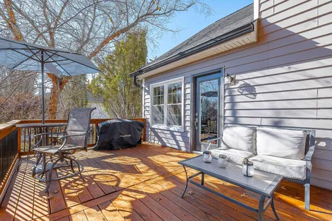 a view of a patio with a table and chairs