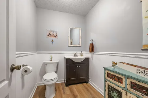 a bathroom with a toilet a sink and bathtub