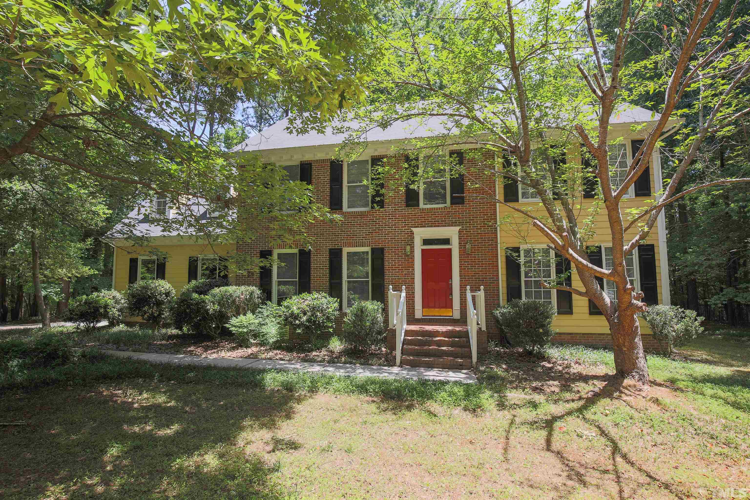 12020 Old Creedmoor Road Raleigh, NC 27613 - Photo 1 of 30 a front view of a house with garden