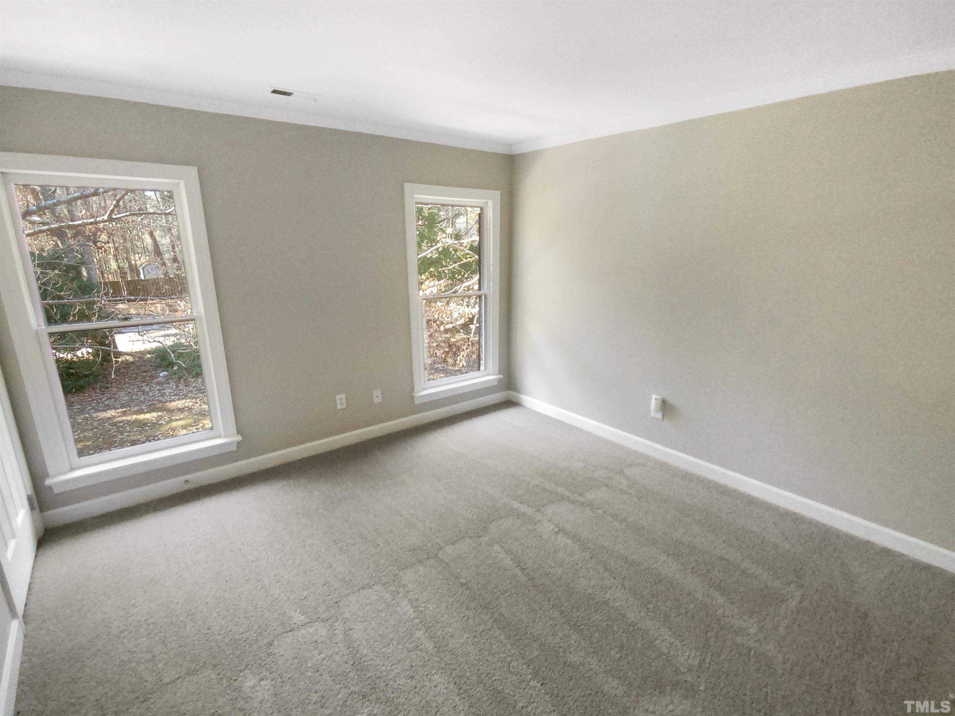 12020 Old Creedmoor Road Raleigh, NC 27613 - Photo 15 of 30 a view of an empty room with a window