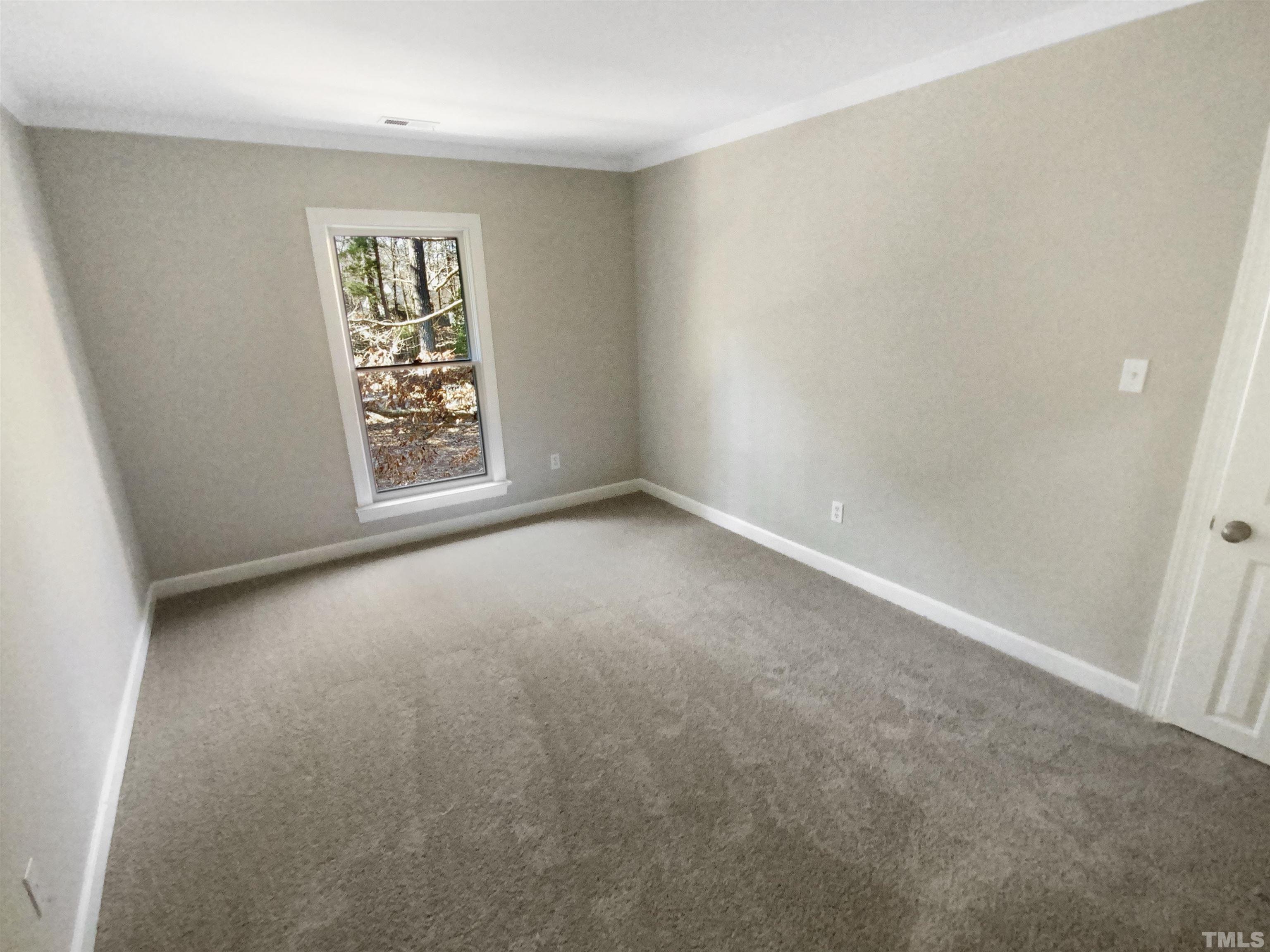 12020 Old Creedmoor Road Raleigh, NC 27613 - Photo 16 of 30 an empty room with windows and closet