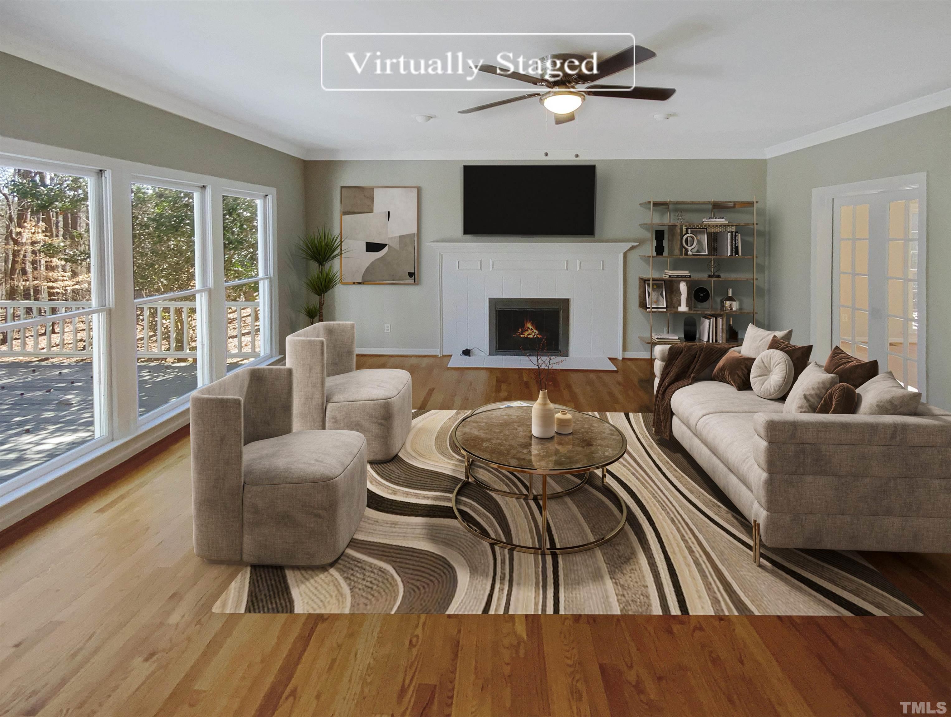 12020 Old Creedmoor Road Raleigh, NC 27613 - Photo 2 of 30 a living room with furniture a fireplace and a flat screen tv