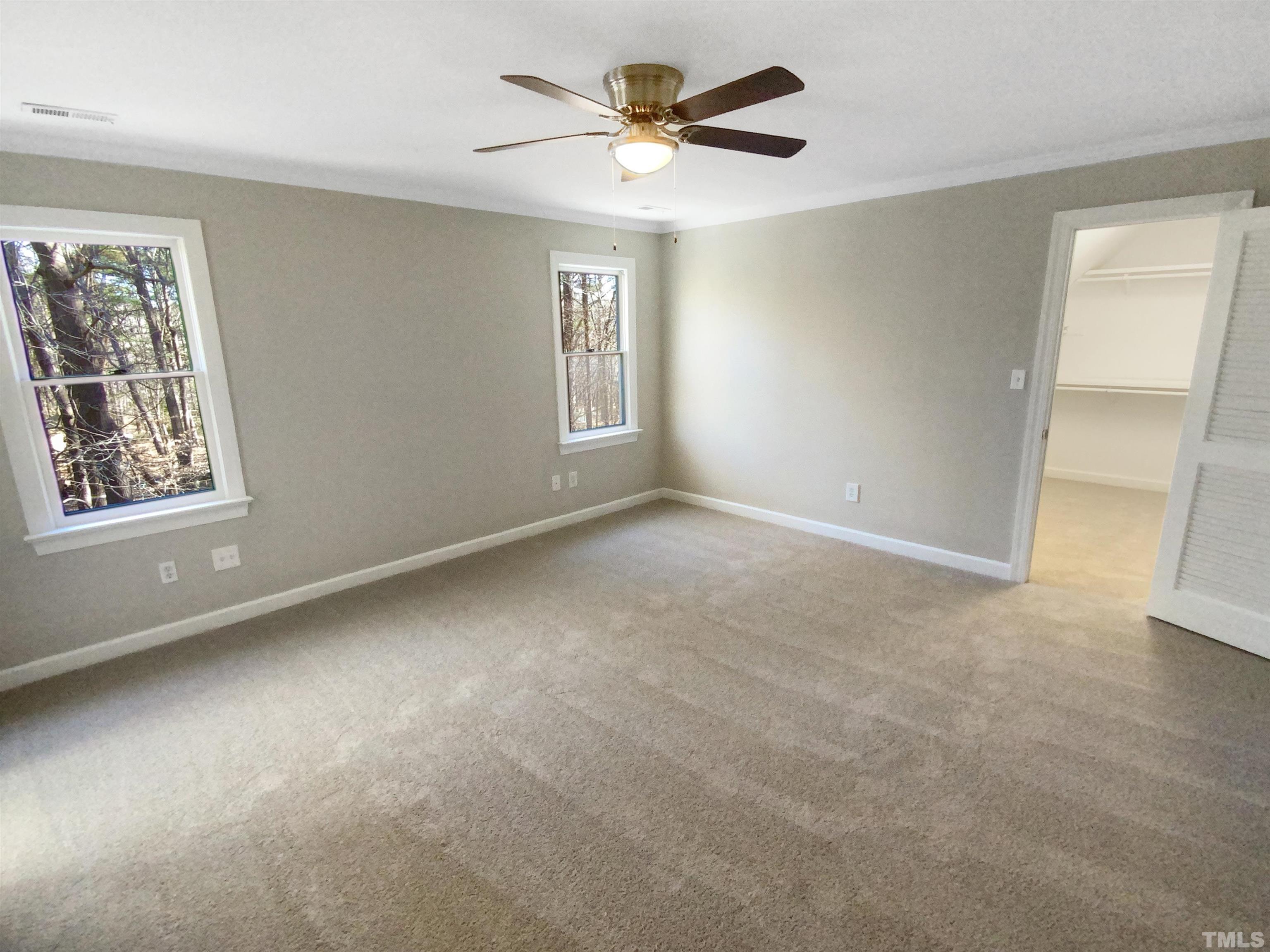12020 Old Creedmoor Road Raleigh, NC 27613 - Photo 21 of 30 a view of an empty room with a window