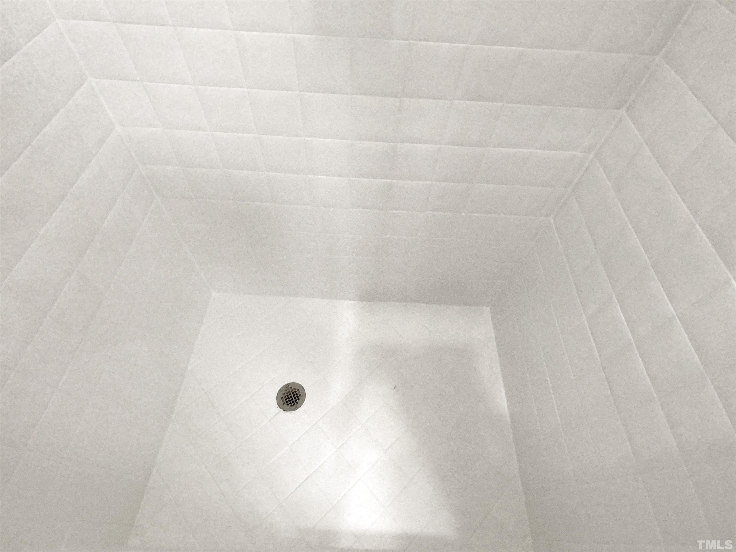 12020 Old Creedmoor Road Raleigh, NC 27613 - Photo 22 of 30 a bathroom with a glass shower door