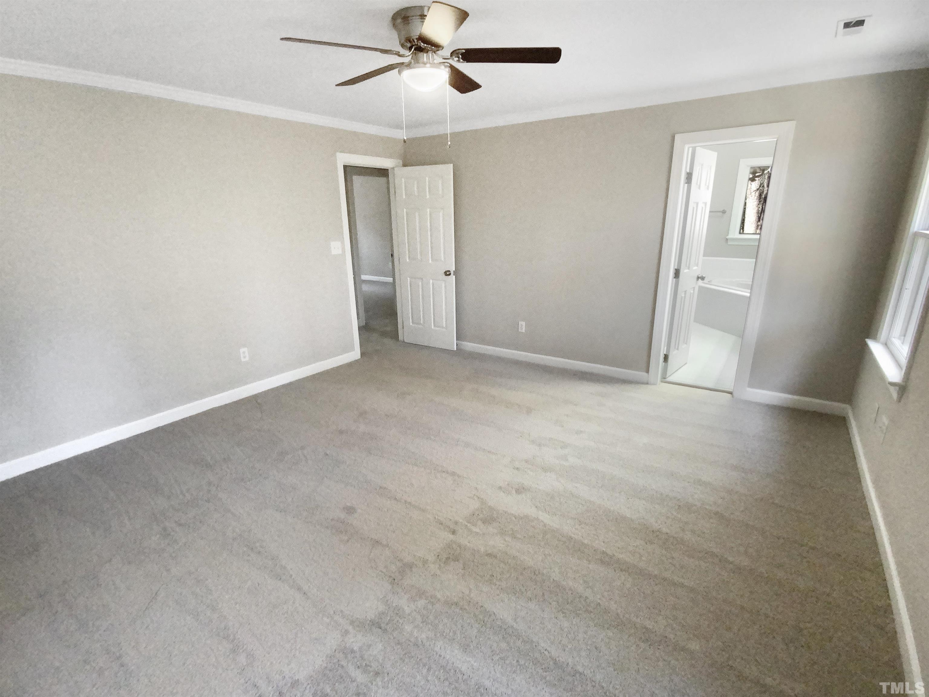 12020 Old Creedmoor Road Raleigh, NC 27613 - Photo 25 of 30 a view of an empty room with a window