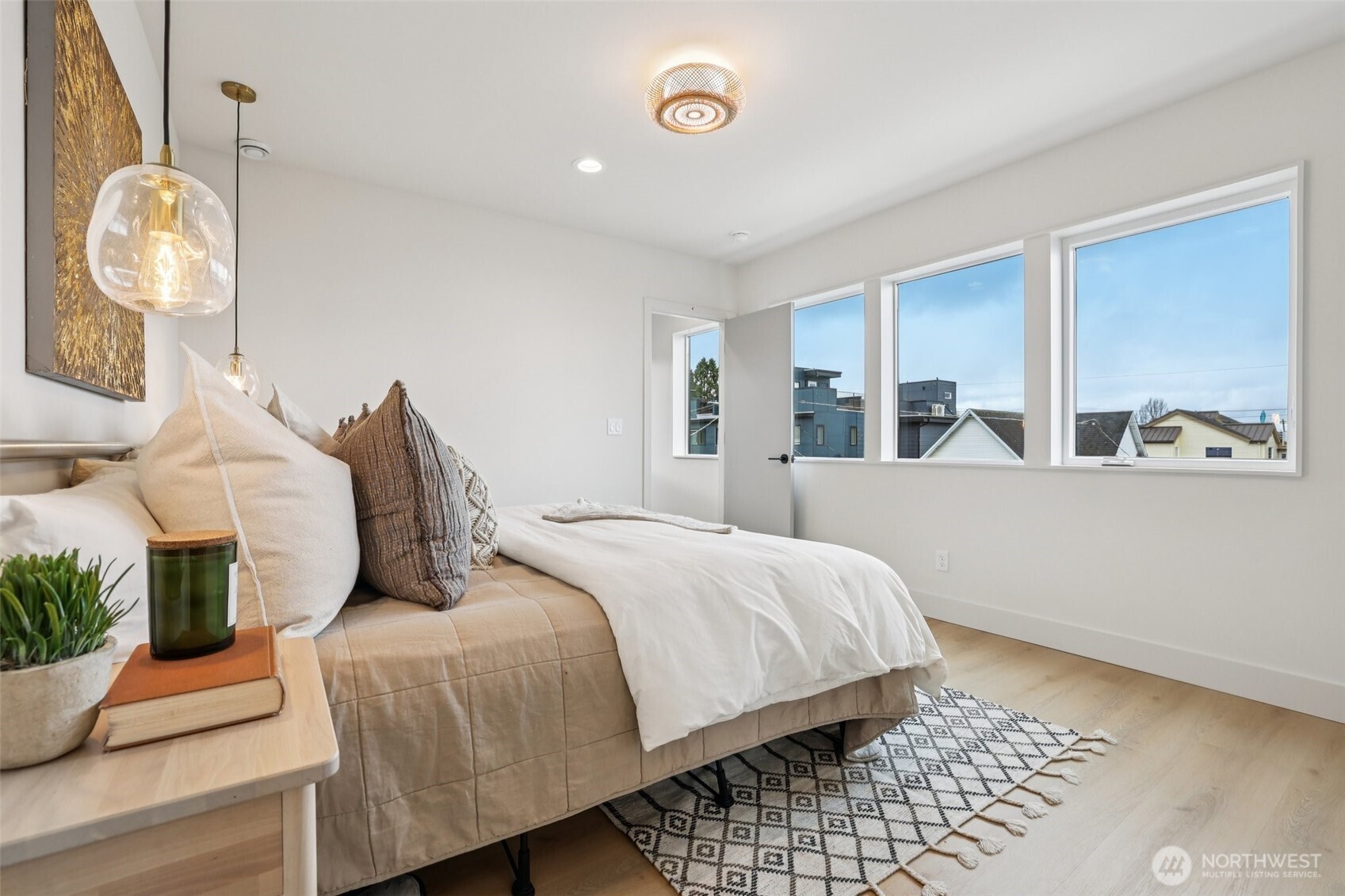2628 58th Avenue Southwest Seattle, WA 98116 - Photo 16 of 40 a bedroom with a bed and window