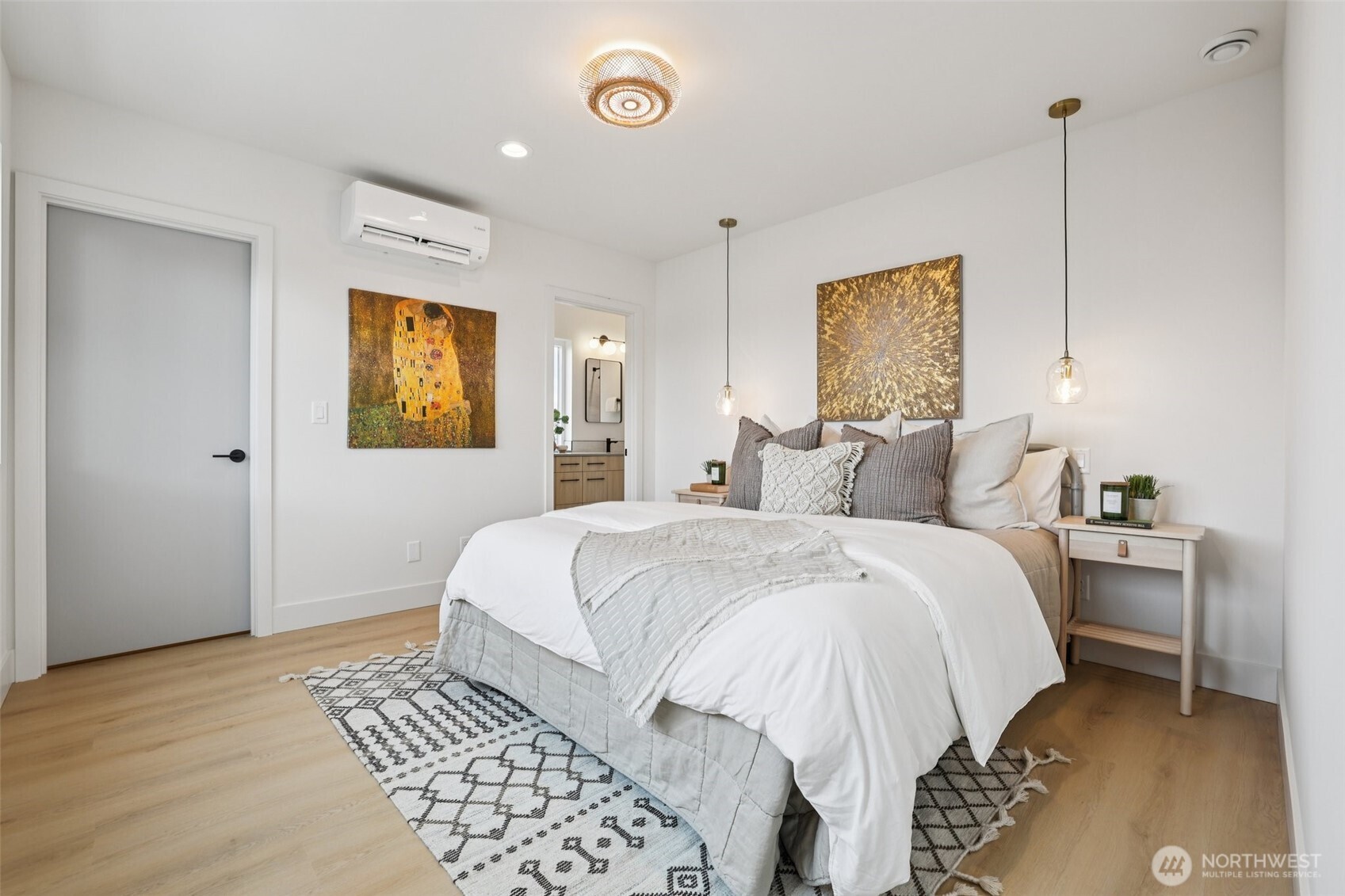 2628 58th Avenue Southwest Seattle, WA 98116 - Photo 17 of 40 a bedroom with a bed and a chandelier