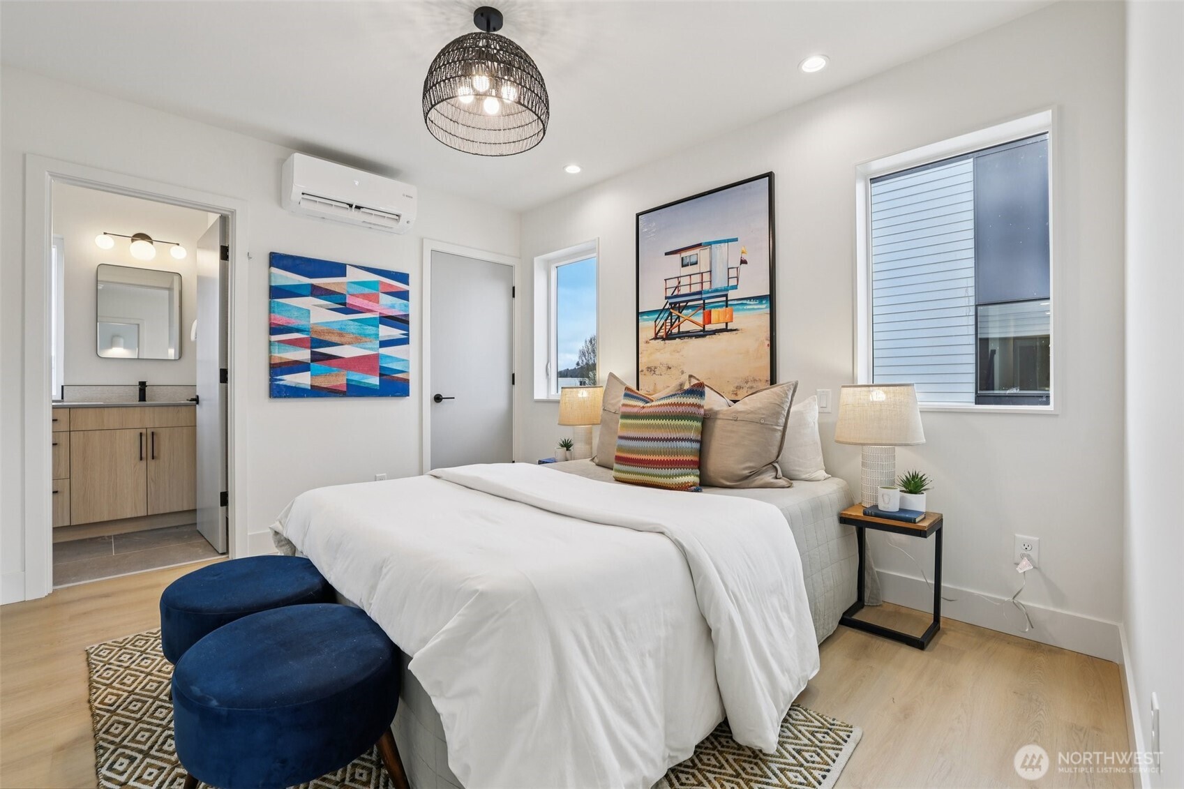 2628 58th Avenue Southwest Seattle, WA 98116 - Photo 21 of 40 a bedroom with a bed and a chandelier