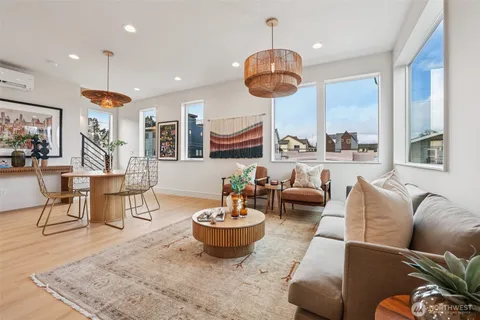 a view of a dining room with furniture window and wooden floor