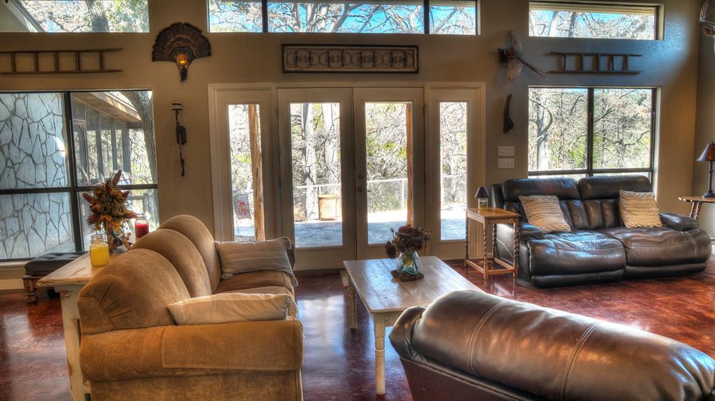 187 Roy Chisum Road Leakey, TX 78873 - Photo 18 of 40 a living room with furniture and a large window