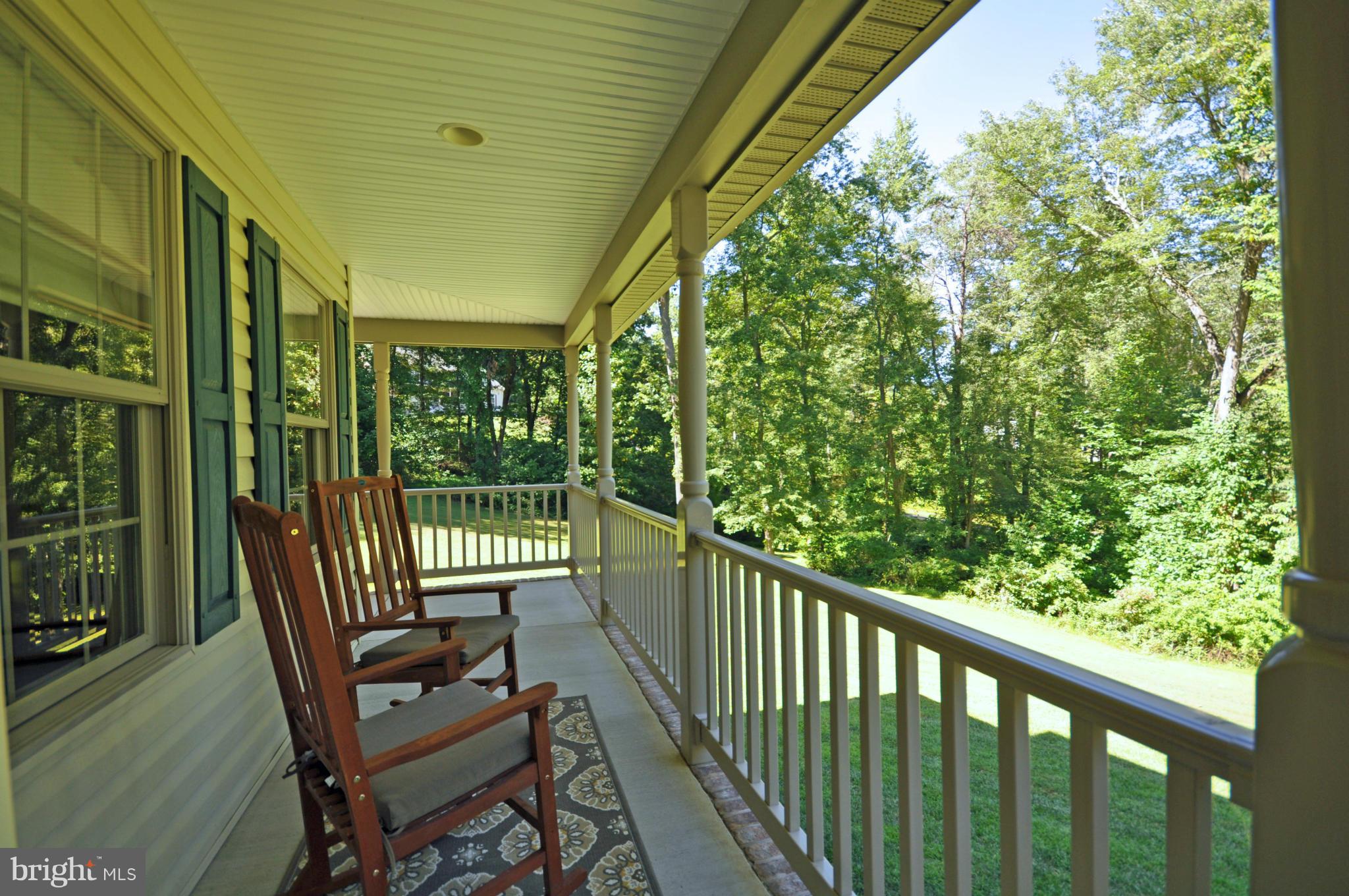 19300 Falls Road Hampstead, MD 21074 - Photo 1 of 30 Wraparound Porch with Serene Wooded View