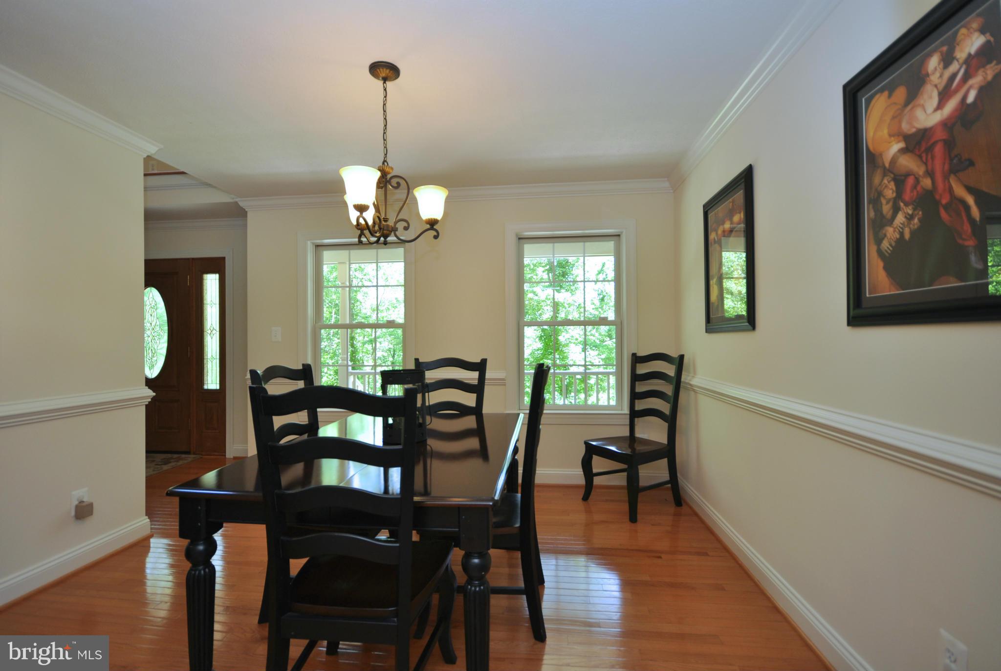 19300 Falls Road Hampstead, MD 21074 - Photo 6 of 30 Dining Room with Chair and Crown Moldings