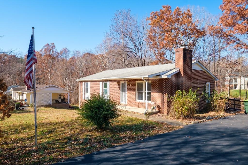 930 Claudius Court Crozet, VA 22932 - Photo 1 of 19 a front view of a house with garden