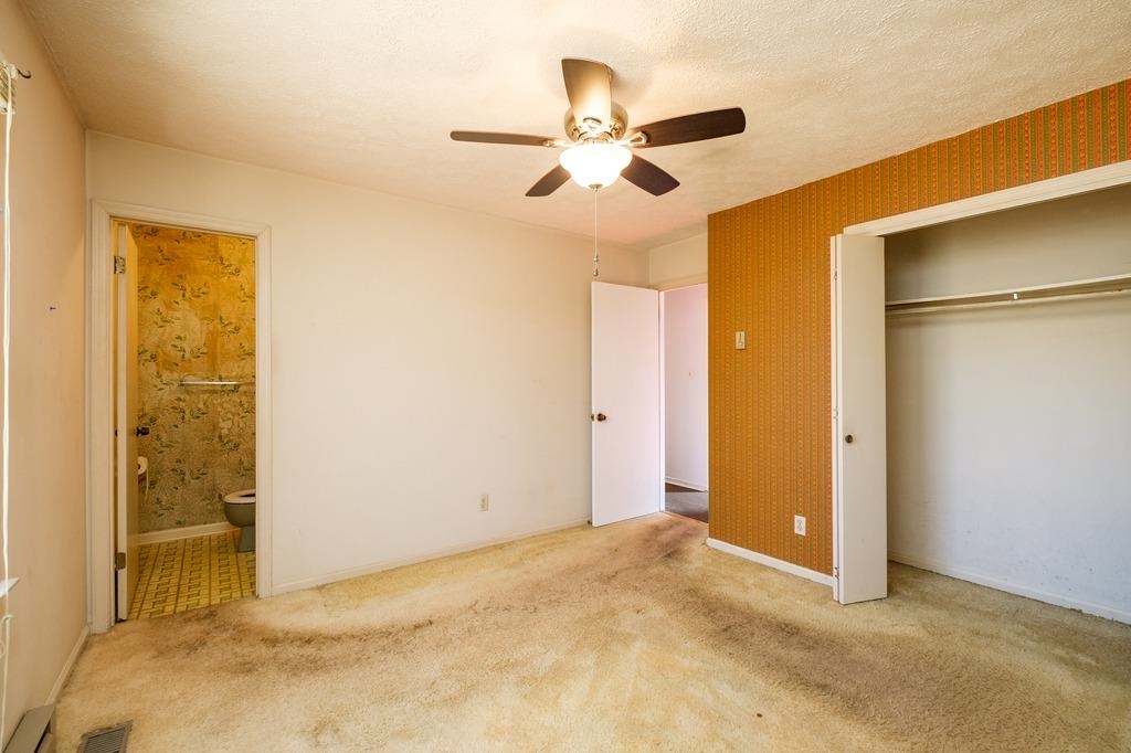 930 Claudius Court Crozet, VA 22932 - Photo 11 of 19 an empty room with closet and a ceiling fan