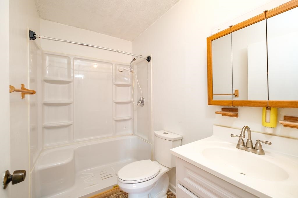 930 Claudius Court Crozet, VA 22932 - Photo 13 of 19 a bathroom with a sink a toilet and shower