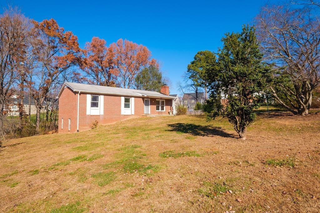 930 Claudius Court Crozet, VA 22932 - Photo 2 of 19 a yellow house with trees in front of it