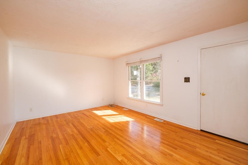 930 Claudius Court Crozet, VA 22932 - Photo 5 of 19 a view of an empty room with wooden floor and a window