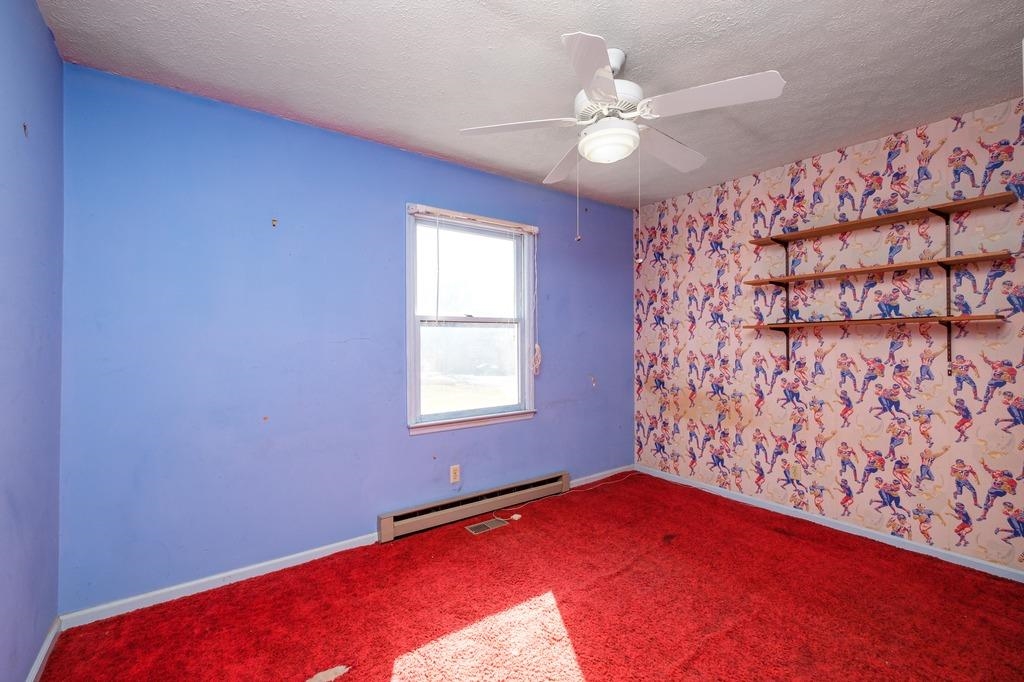 930 Claudius Court Crozet, VA 22932 - Photo 10 of 19 a view of an empty room with window and a chandelier fan