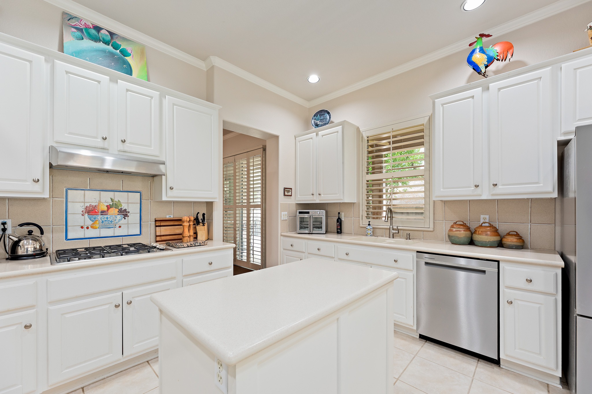 106 Wild Turkey Lane Georgetown, TX 78633 - Photo 13 of 39 a kitchen with white cabinets and white appliances