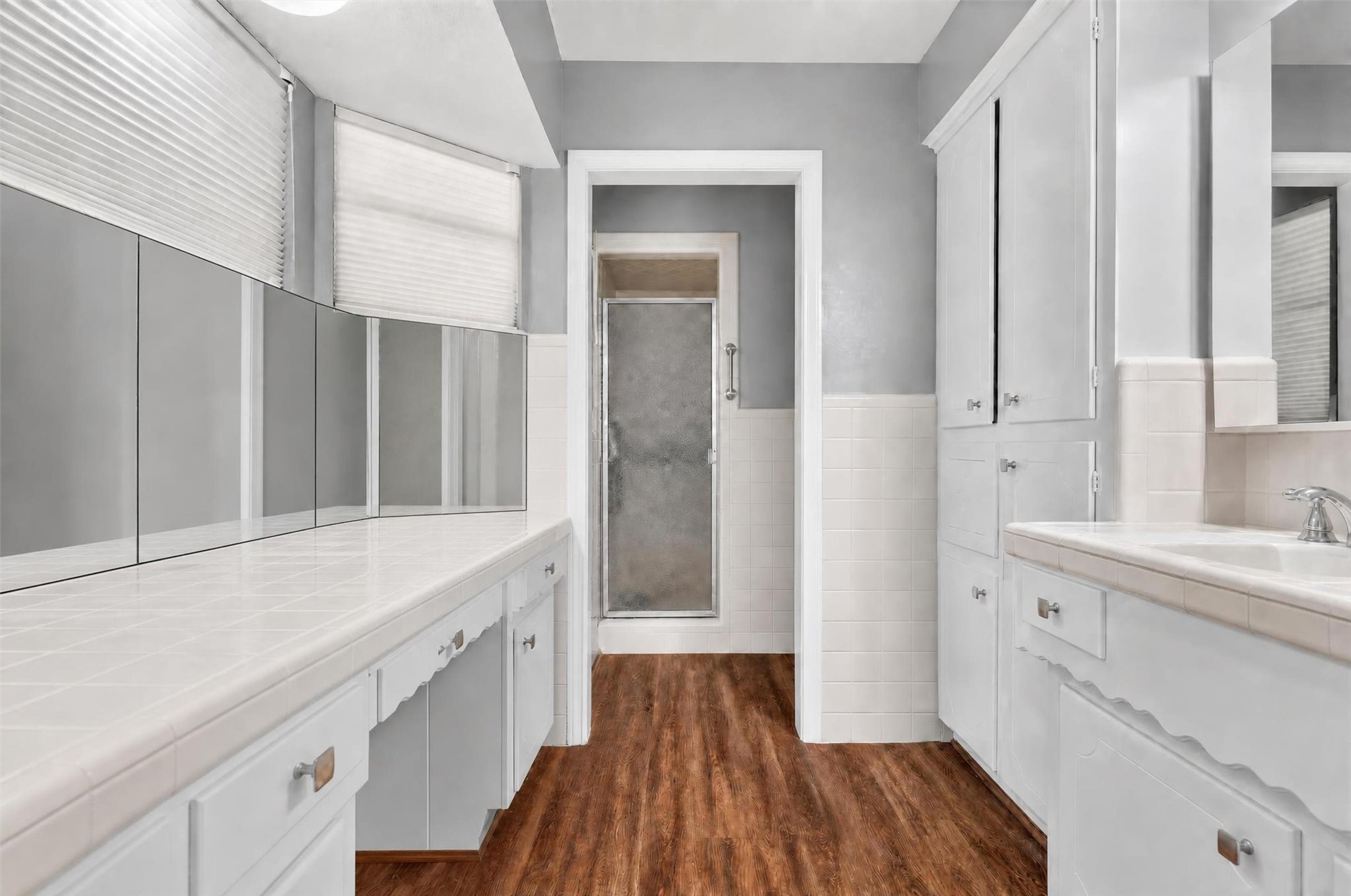 12625 Huffmeister Road Cypress, TX 77429 - Photo 21 of 50 Start your mornings with room to relax and get ready for the day! This primary bathroom offers generous counter space, abundant cabinetry, a dedicated vanity area, and a separate shower. A comfortable, functional retreat with plenty of space for your daily routine.