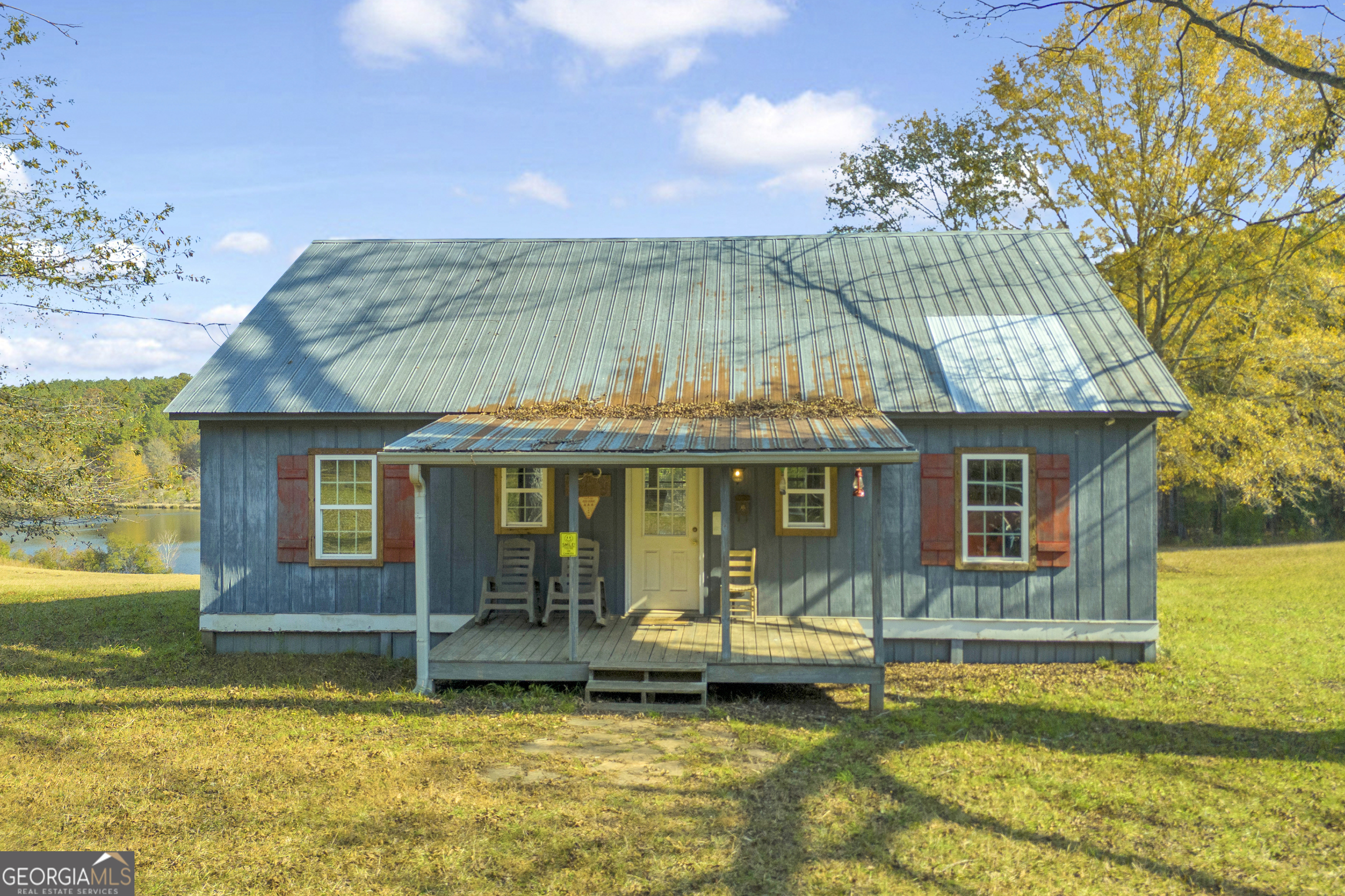 23824 Highway 22 Sparta, GA 31087 - Photo 1 of 94 a view of a house with swimming pool and a porch with furniture