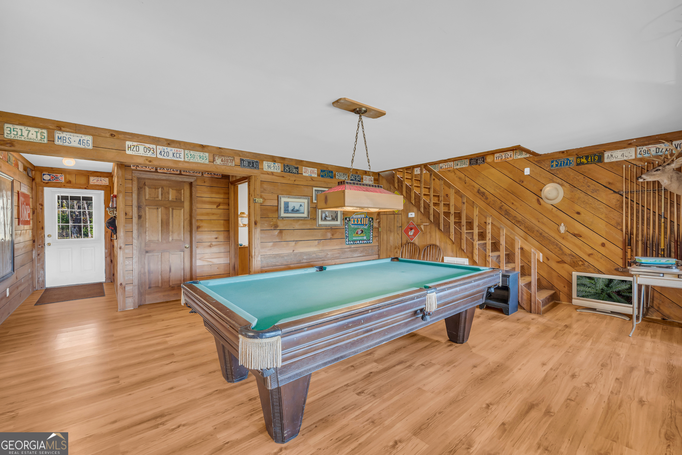 23824 Highway 22 Sparta, GA 31087 - Photo 11 of 94 a room with pool table and wooden floor