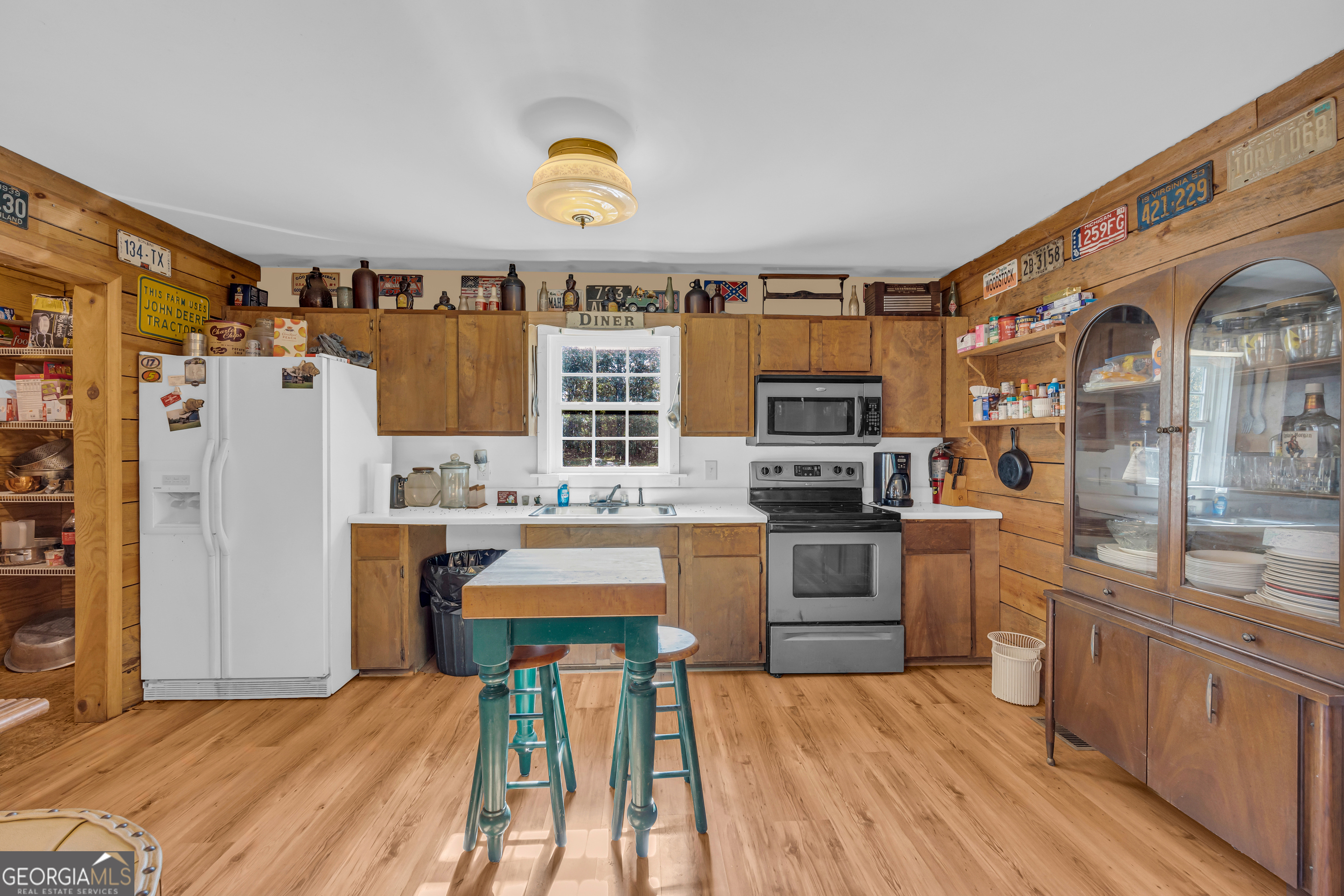 23824 Highway 22 Sparta, GA 31087 - Photo 15 of 94 a kitchen with stainless steel appliances granite countertop a stove a sink dishwasher and a refrigerator