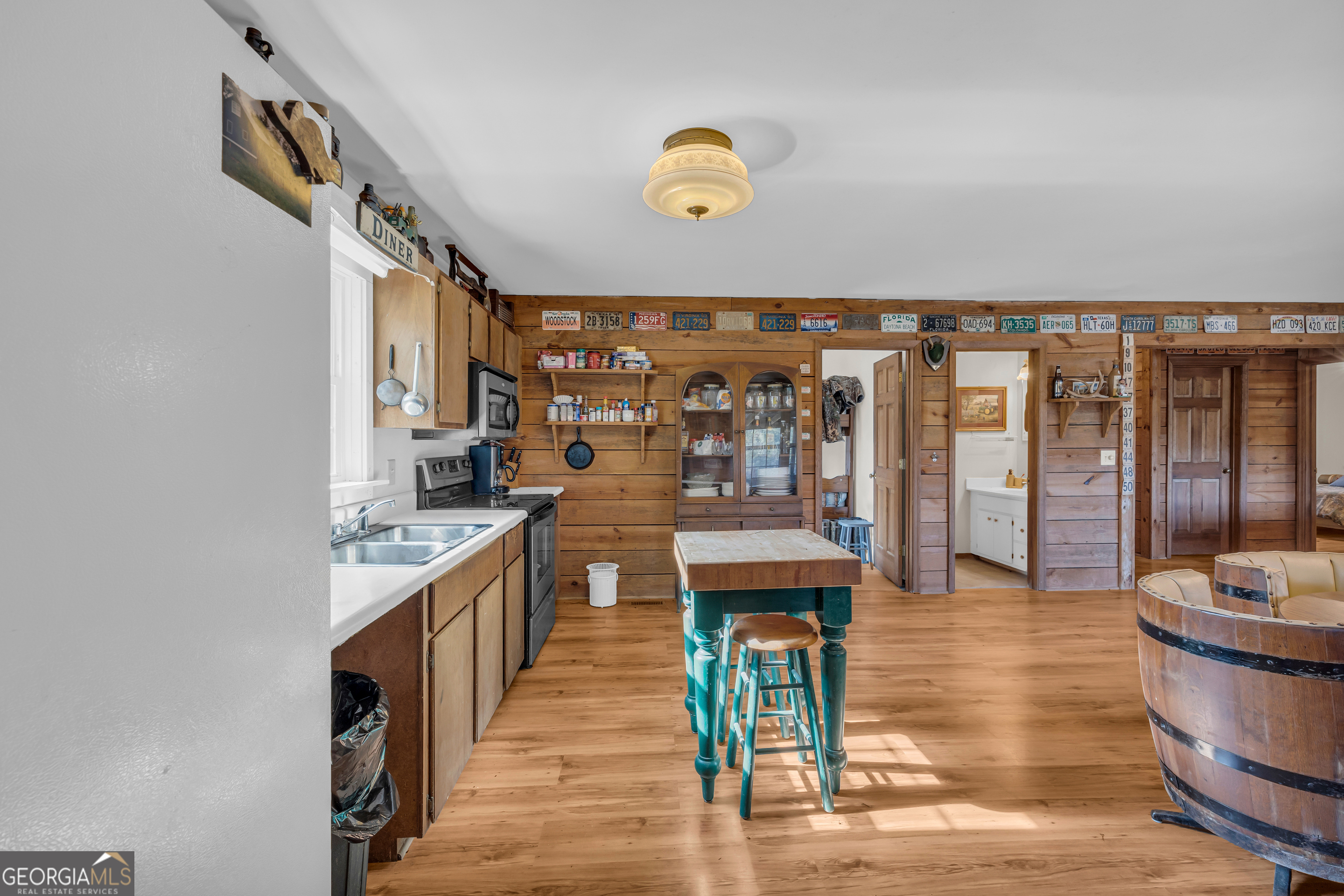23824 Highway 22 Sparta, GA 31087 - Photo 19 of 94 a kitchen with stainless steel appliances granite countertop a sink and wooden cabinets
