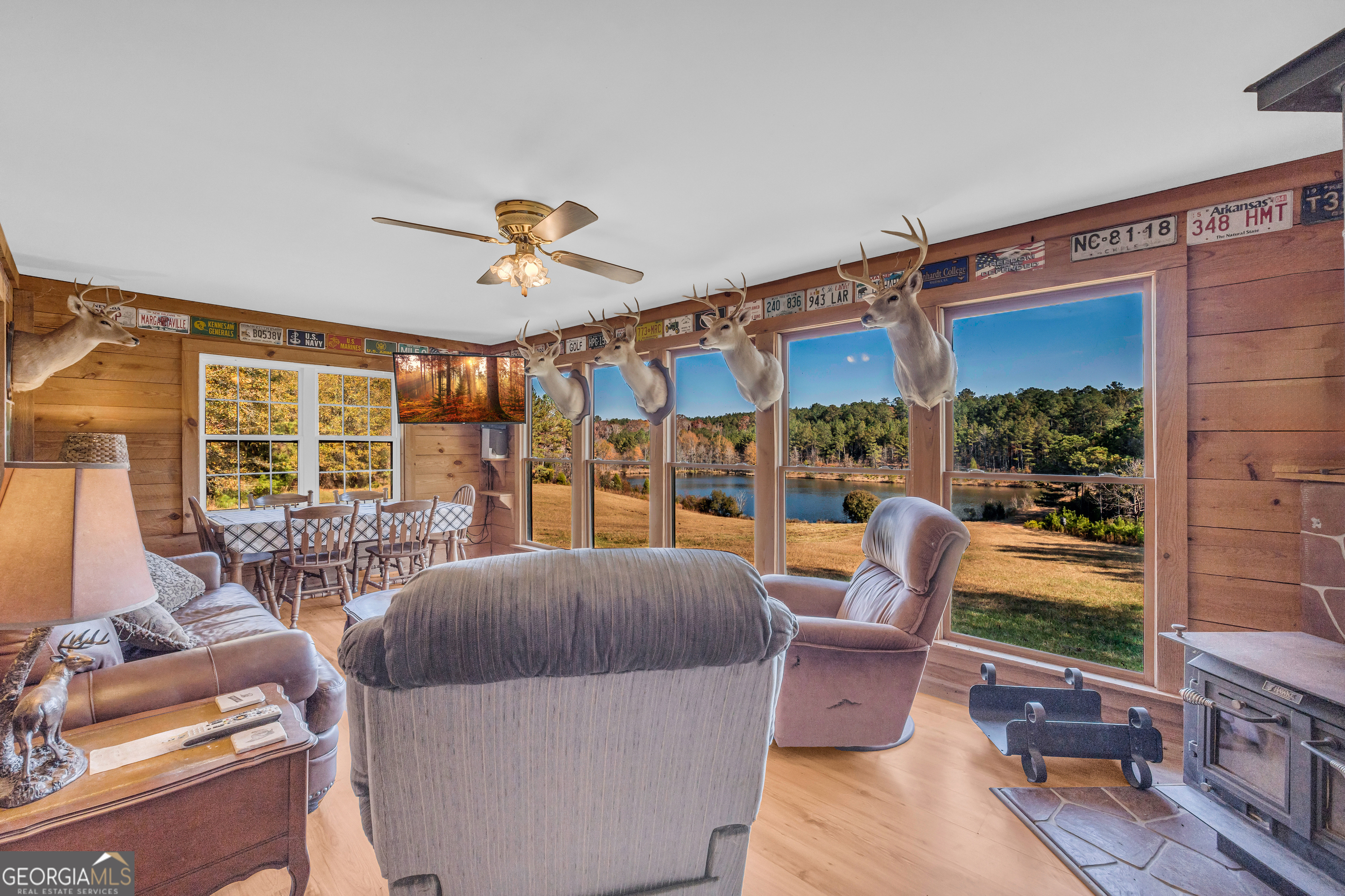 23824 Highway 22 Sparta, GA 31087 - Photo 20 of 94 a living room with furniture and a floor to ceiling window