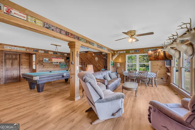 a bedroom with furniture and a wooden floor