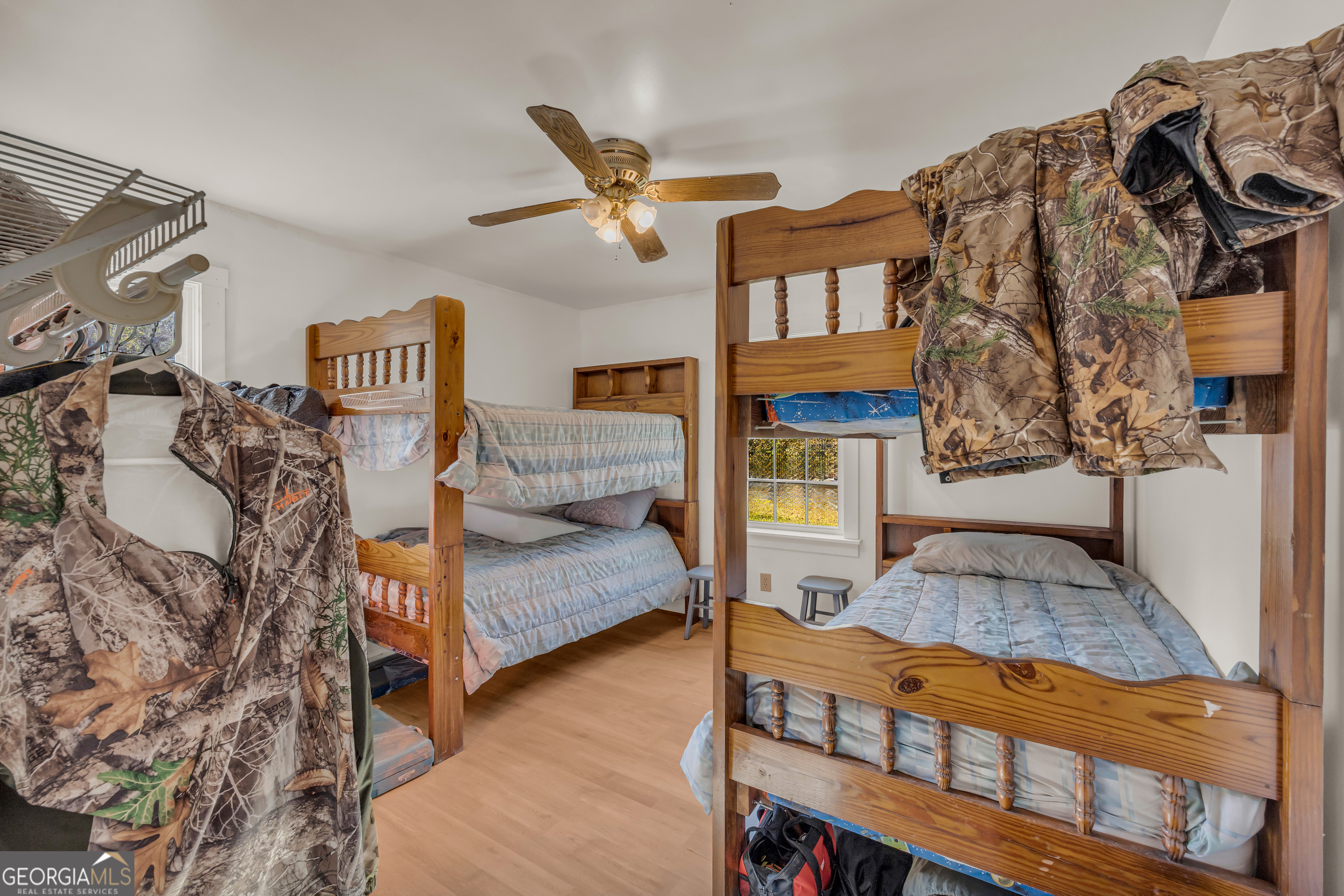 23824 Highway 22 Sparta, GA 31087 - Photo 28 of 94 a bedroom with furniture and a wooden floor