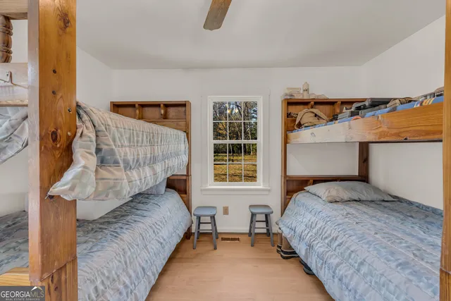 a view of a balcony with furniture and wooden floor