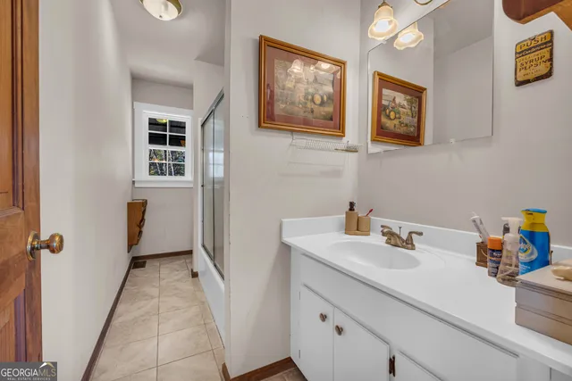 a bedroom with furniture and a chair