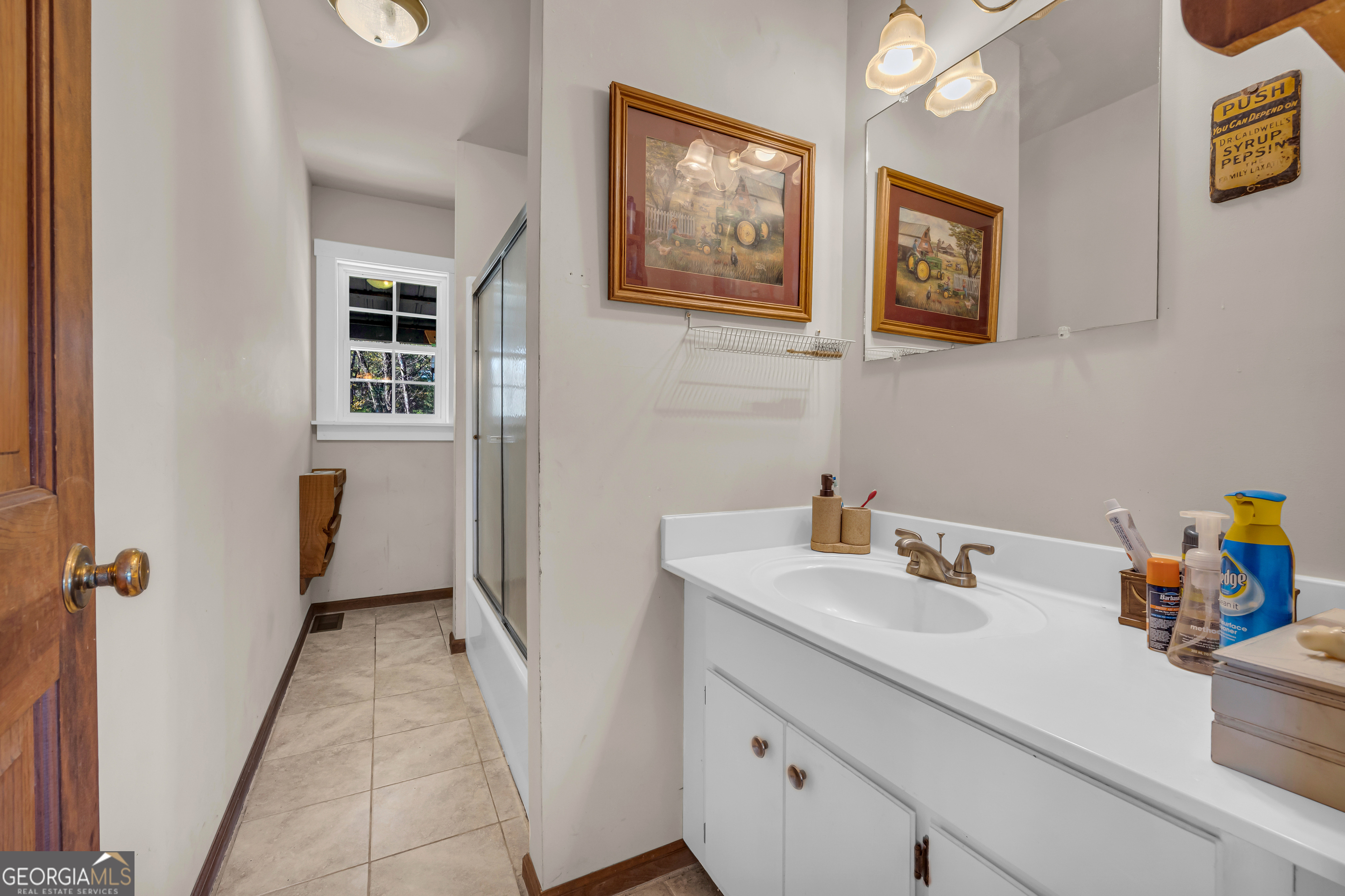 23824 Highway 22 Sparta, GA 31087 - Photo 31 of 94 a bathroom with a sink and a mirror